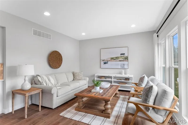 Living area with wood finished floors and recessed lighting — 1 TBB Bridgeport @ Kreder Farms, St Charles, MO 63304