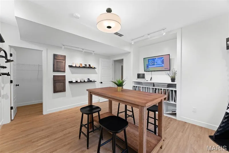Dining area featuring rail lighting and light wood-style floors — 1 TBB Bridgeport @ Kreder Farms, St Charles, MO 63304