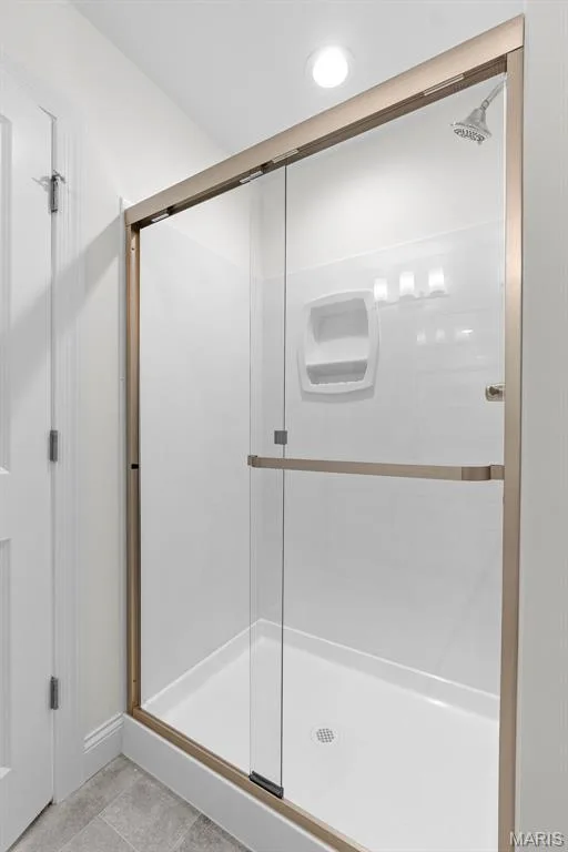 Bathroom featuring light tile patterned floors and a shower stall — 1 TBB Sydney @ Kreder Farms, St Charles, MO 63304