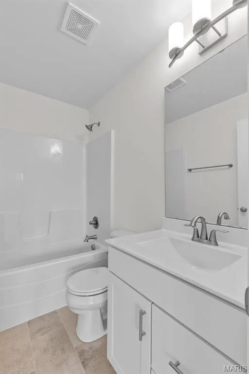 Full bath featuring vanity,  shower combination, and light tile patterned floors — 1 TBB Sydney @ Kreder Farms, St Charles, MO 63304