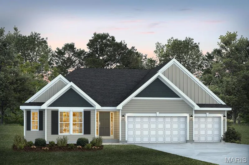 View of front facade featuring concrete driveway, board and batten siding, a garage, and a yard — 1 TBB Canterbury @ Creekside Sommers, O'Fallon, MO 63367