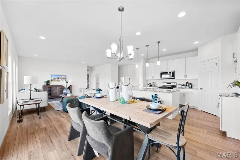 Dining room with light wood-style flooring, recessed lighting, and a chandelier — 1 TBB Westbrook @ Creekside Sommers, O'Fallon, MO 63367