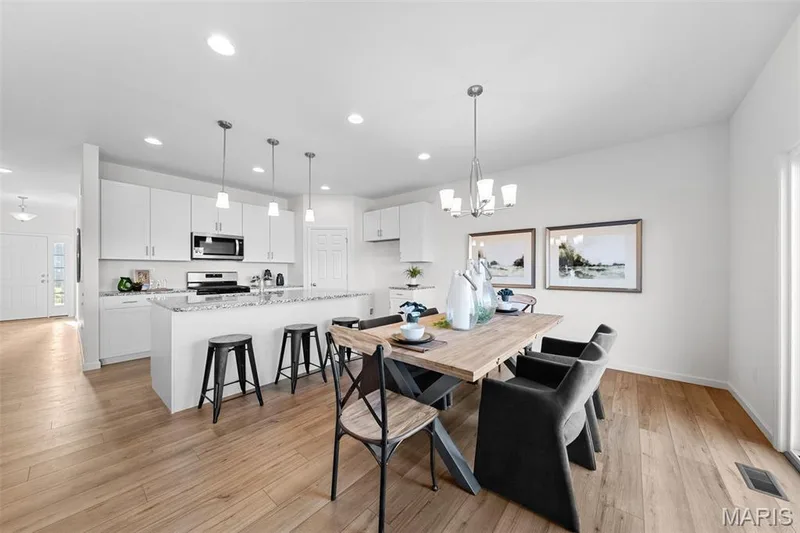 Dining space with light wood-type flooring, a chandelier, and recessed lighting — 1 TBB Westbrook @ Creekside Sommers, O'Fallon, MO 63367