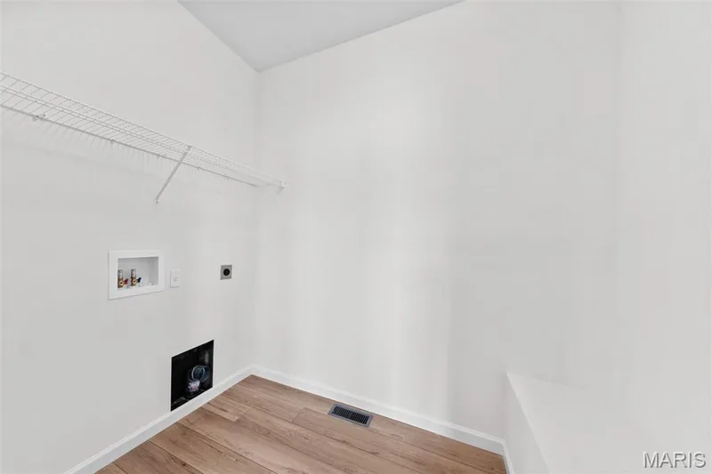 Washroom with light wood finished floors, hookup for an electric dryer, and washer hookup — 1 TBB Westbrook @ Creekside Sommers, O'Fallon, MO 63367
