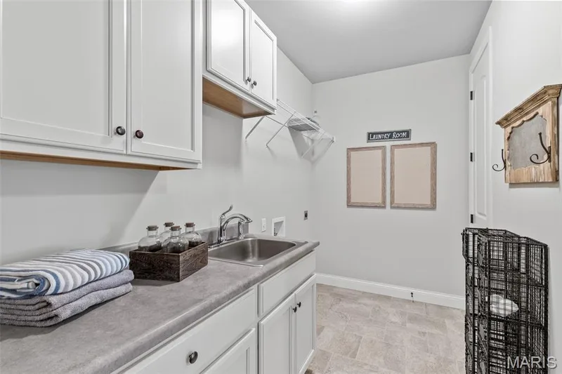 Washroom with cabinet space and washer hookup — 1 TBB Kingston @Willow Grove, Dardenne Prairie, MO 63368