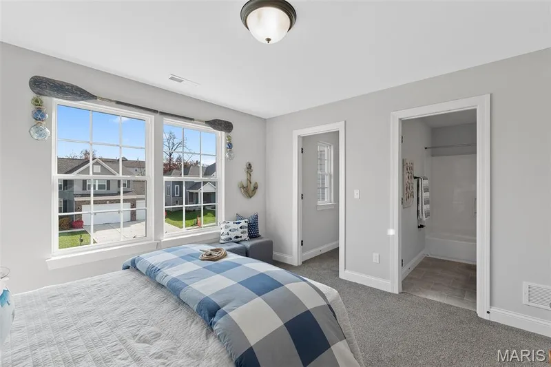 Bedroom featuring light colored carpet and connected bathroom — 1 TBB Kingston @ Chateau De Fond Du Lac, Lake St. Louis, MO 63367