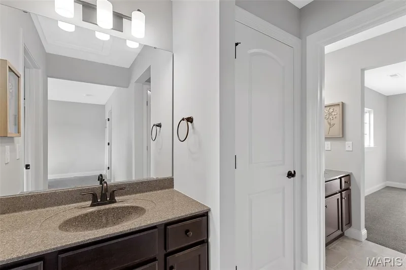 Bathroom with vanity and light carpet — 1 TBB Kingston @ Chateau De Fond Du Lac, Lake St. Louis, MO 63367