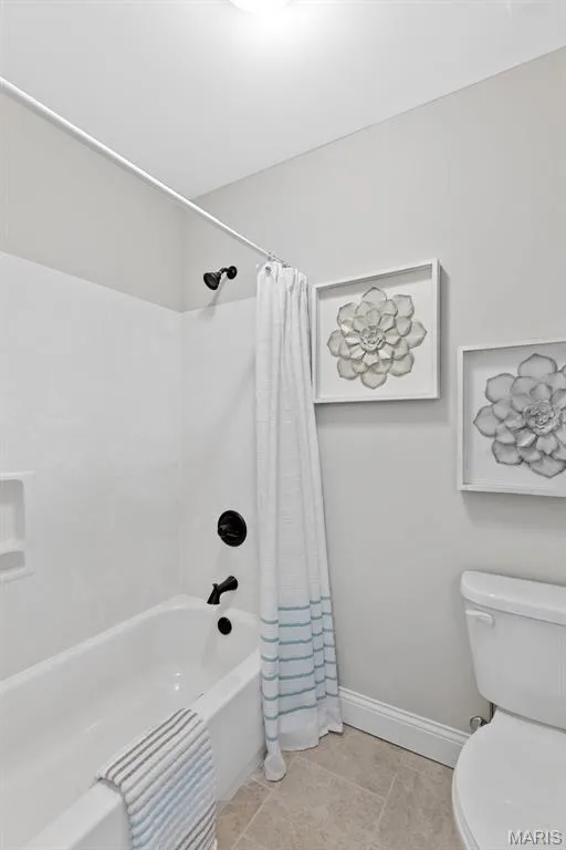 Bathroom with shower / bath combo and light tile patterned flooring — 1 TBB Kingston @ Chateau De Fond Du Lac, Lake St. Louis, MO 63367