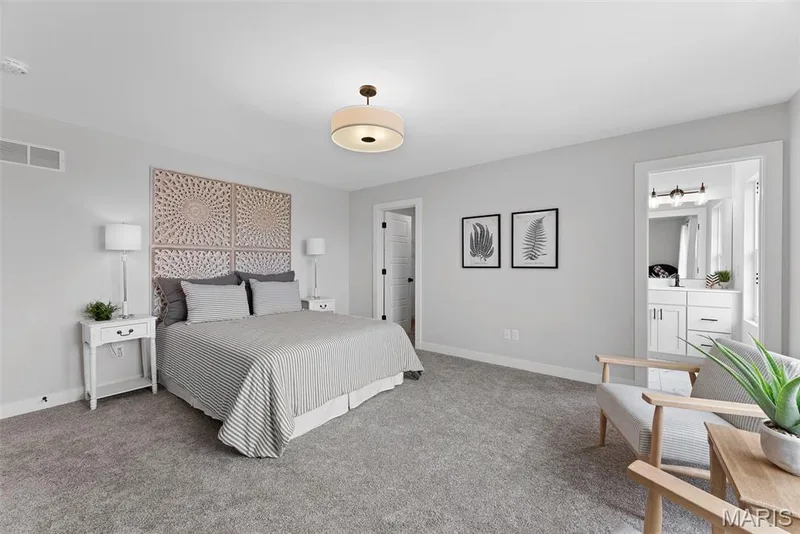 Carpeted bedroom featuring baseboards — 1 TBB Bridgeport @ Chateau De Fond Du Lac, Lake St. Louis, MO 63367