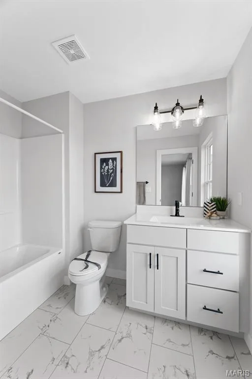 Bathroom featuring vanity, washtub / shower combination, and light marble finish floors — 1 TBB Bridgeport @ Chateau De Fond Du Lac, Lake St. Louis, MO 63367