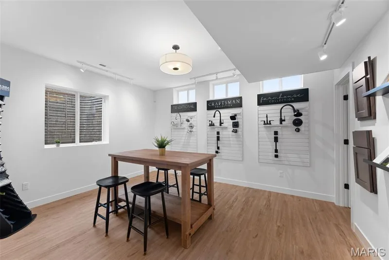 Dining space featuring rail lighting and light wood-type flooring — 1 TBB Bridgeport @ Chateau De Fond Du Lac, Lake St. Louis, MO 63367