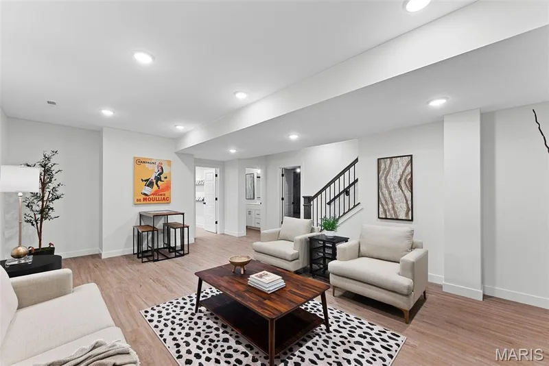 Living area featuring light wood finished floors, recessed lighting, and stairs — 1 TBB Bridgeport @ Chateau De Fond Du Lac, Lake St. Louis, MO 63367