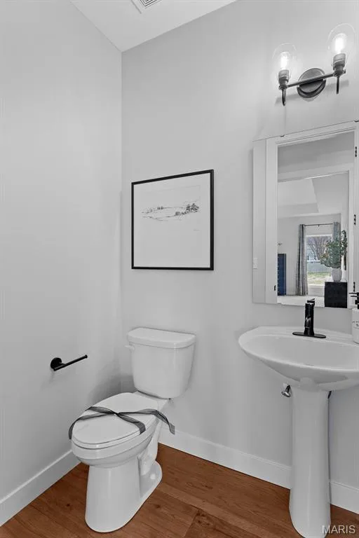 Bathroom with wood finished floors and baseboards — 1 TBB Bridgeport @Willow Grove, Dardenne Prairie, MO 63368