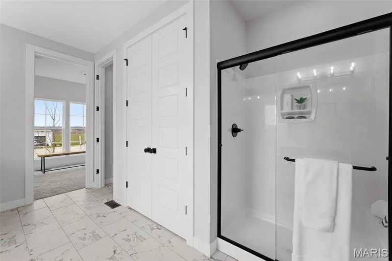 Bathroom with light marble finish flooring and a stall shower — 1 TBB Bridgeport @Willow Grove, Dardenne Prairie, MO 63368