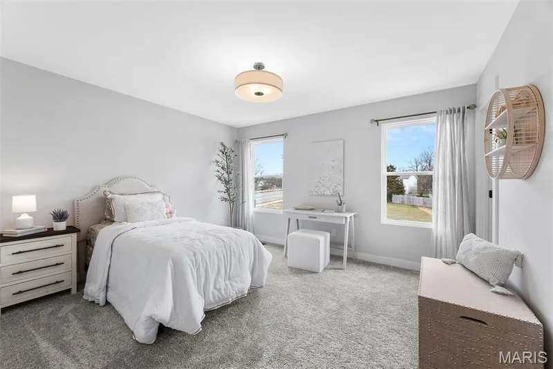 Bedroom featuring light colored carpet and baseboards — 1 TBB Bridgeport @Willow Grove, Dardenne Prairie, MO 63368