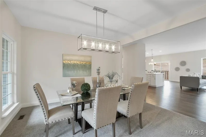 Dining area with dark carpet and a chandelier — 1 TBB Waverly @ Chateau De Fond Du Lac, Lake St. Louis, MO 63367