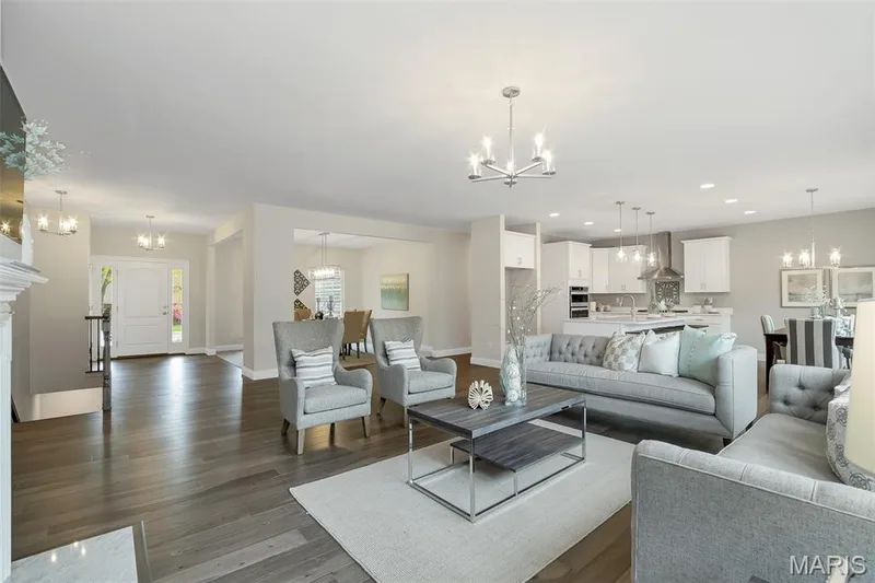 Living area featuring a chandelier, dark wood-style floors, and recessed lighting — 1 TBB Waverly @ Chateau De Fond Du Lac, Lake St. Louis, MO 63367
