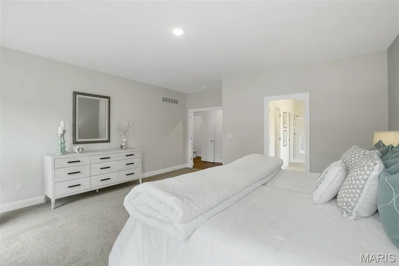 Bedroom featuring carpet flooring and ensuite bath — 1 TBB Waverly @ Chateau De Fond Du Lac, Lake St. Louis, MO 63367