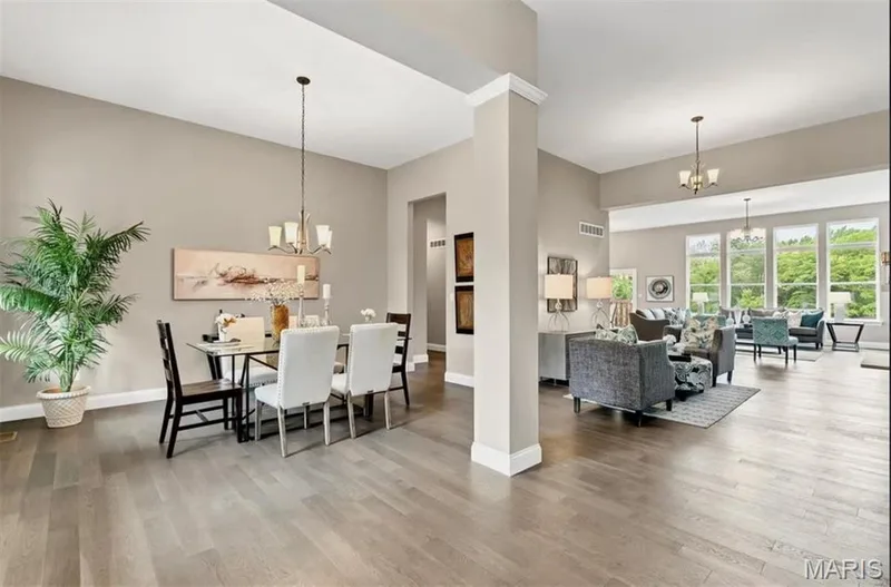 Dining room featuring a chandelier and wood finished floors — 1 TBB Monaco @Willow Grove, Dardenne Prairie, MO 63368
