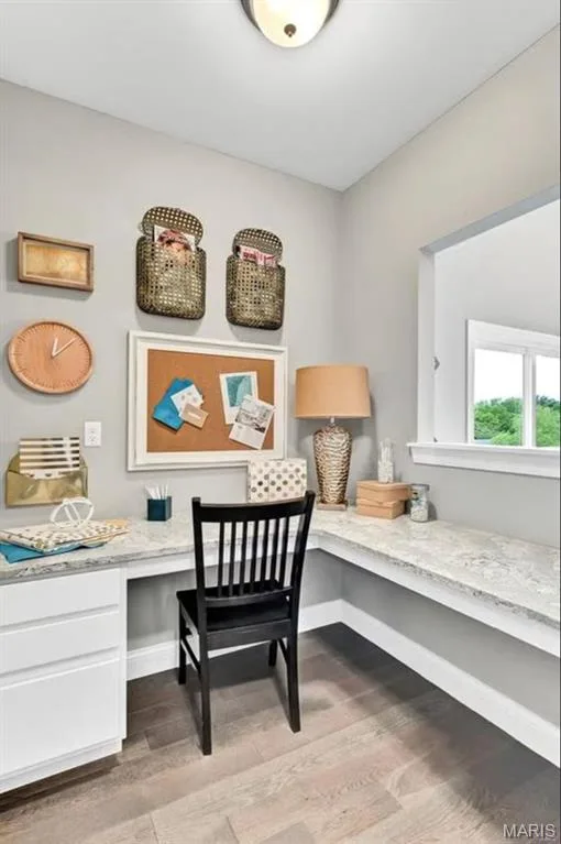 Living area featuring built in desk and light wood-style floors — 1 TBB Monaco @Willow Grove, Dardenne Prairie, MO 63368