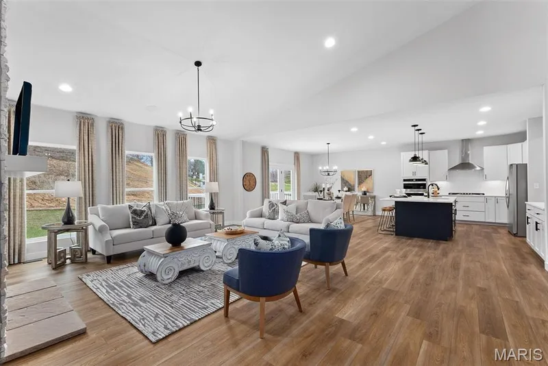 Living room with recessed lighting, a chandelier, dark wood-style flooring, and high vaulted ceiling — 1 TBB Canterbury@ Willow Grove, Dardenne Prairie, MO 63368