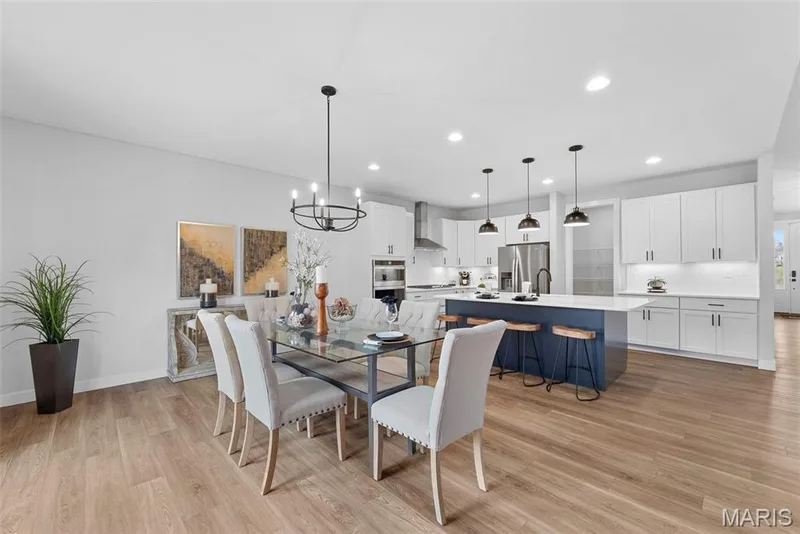Dining room featuring a chandelier, recessed lighting, and light wood-style flooring — 1 TBB Canterbury@ Willow Grove, Dardenne Prairie, MO 63368