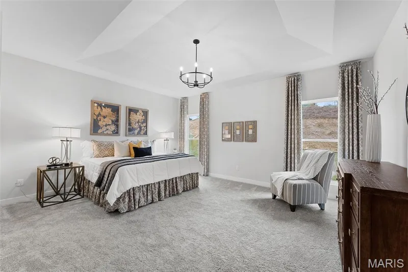 Bedroom with a tray ceiling, carpet, and a chandelier — 1 TBB Canterbury@ Willow Grove, Dardenne Prairie, MO 63368