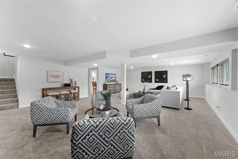 Living room with stairs, recessed lighting, and light colored carpet — 1 TBB Canterbury@ Willow Grove, Dardenne Prairie, MO 63368