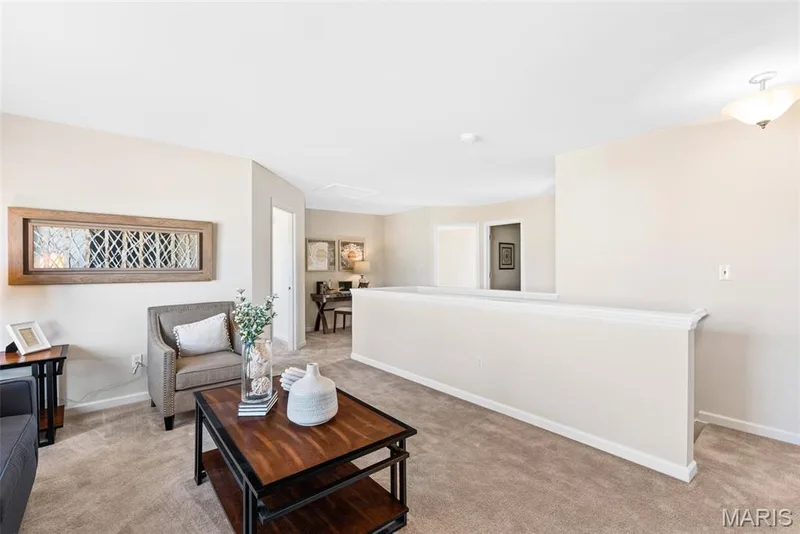Living area with light colored carpet and attic access — 1 TBB Princeton @Willow Grove, Dardenne Prairie, MO 63368
