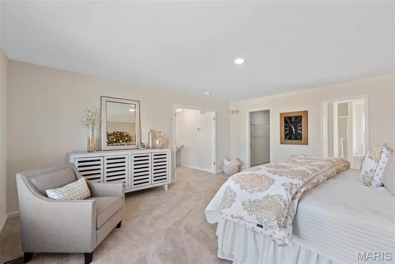 Bedroom featuring carpet flooring, a walk in closet, recessed lighting, and ensuite bath — 1 TBB Princeton @Willow Grove, Dardenne Prairie, MO 63368