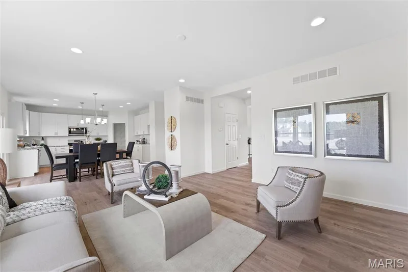 Living room featuring light wood-style flooring and recessed lighting — 1 TBB Barkley @ Creekside Sommers, O'Fallon, MO 63367
