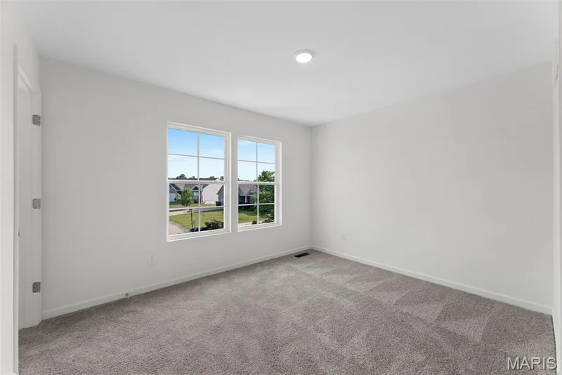 Carpeted spare room featuring baseboards — 1 TBB Barkley @ Creekside Sommers, O'Fallon, MO 63367