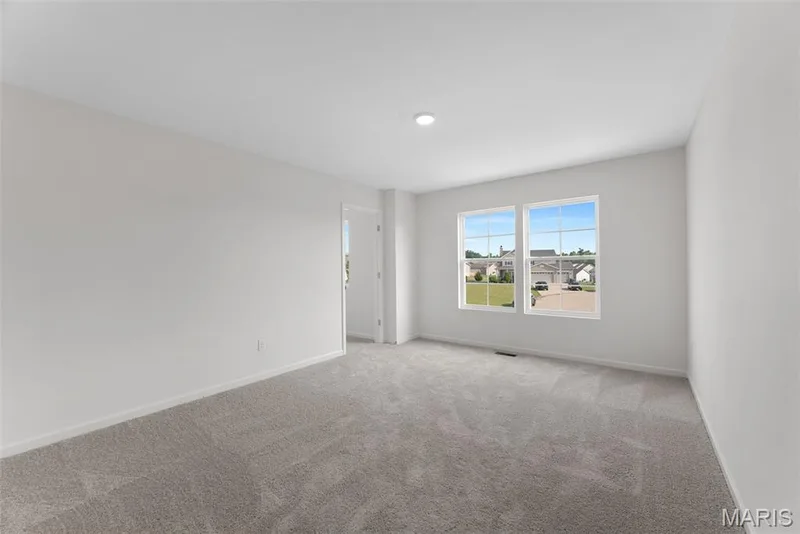Carpeted spare room featuring baseboards — 1 TBB Barkley @ Creekside Sommers, O'Fallon, MO 63367