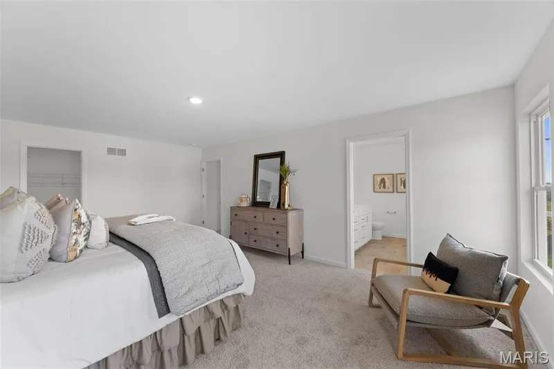 Bedroom featuring carpet flooring, ensuite bath, and recessed lighting — 1 TBB Barkley @ Creekside Sommers, O'Fallon, MO 63367