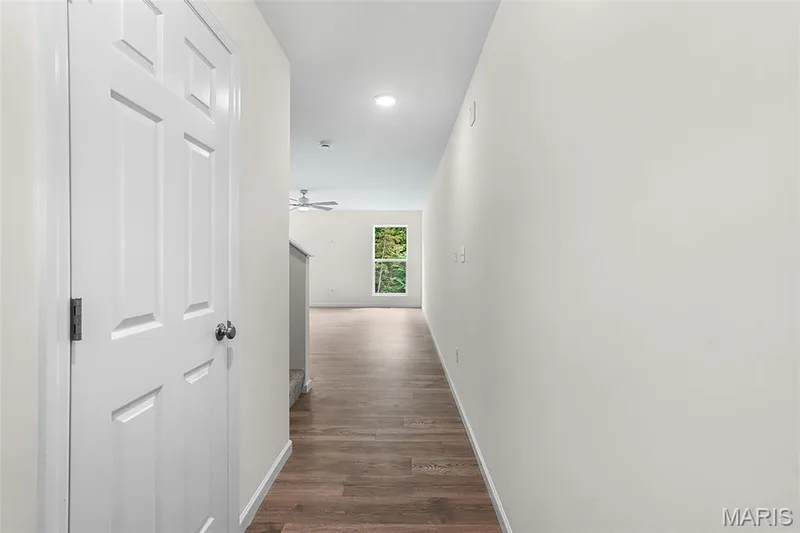 Corridor with dark wood-style floors and recessed lighting — 15 Integrity Court, O'Fallon, MO 63385