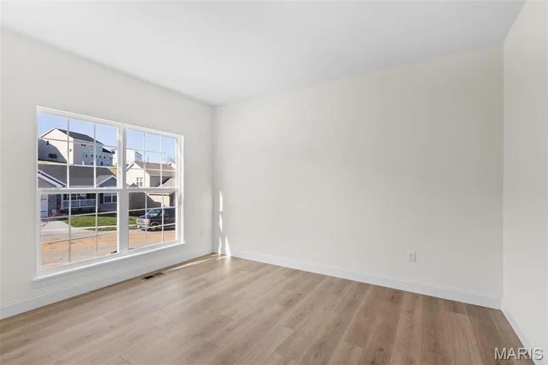 Spare room featuring light wood-type flooring — 3 Sequoia at Bluestem Estates, St Charles, MO 63367