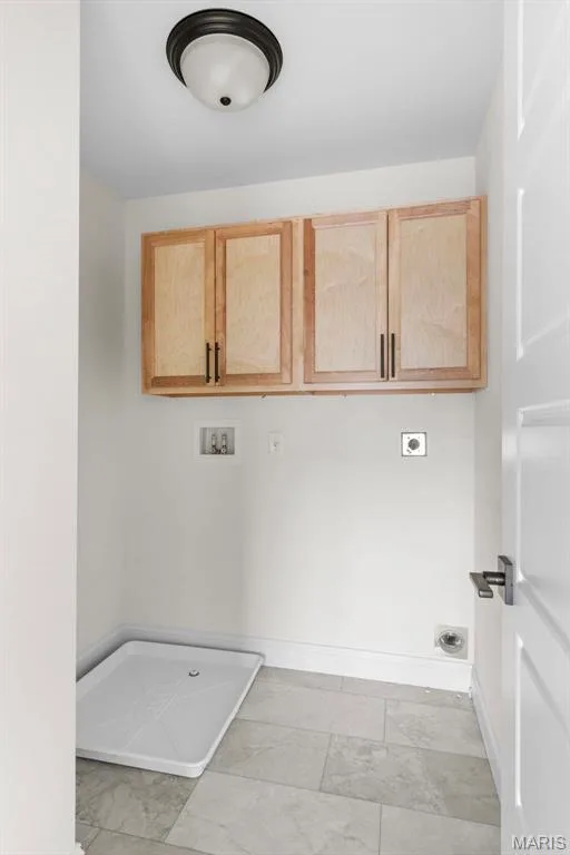 Laundry room with washer hookup, electric dryer hookup, and cabinets — 3 Sequoia at Bluestem Estates, St Charles, MO 63367