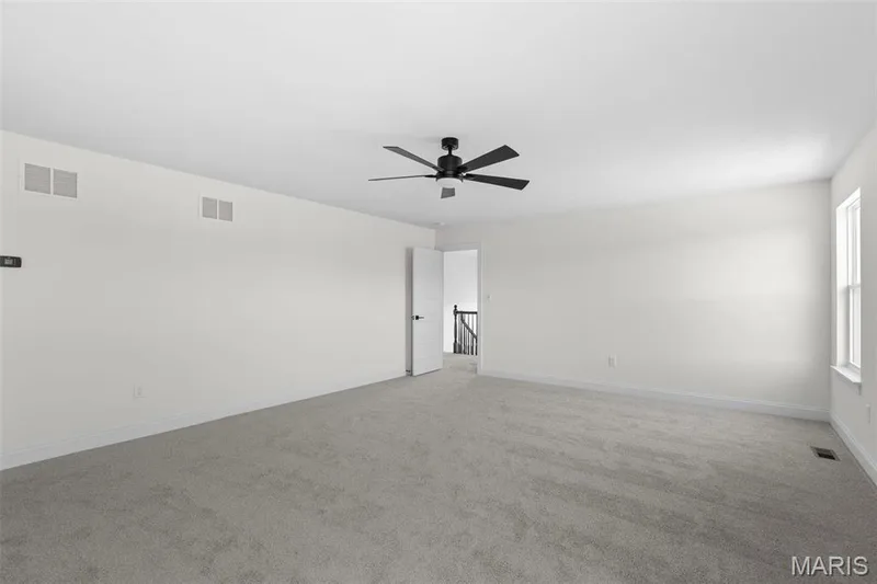 Unfurnished room with light carpet and ceiling fan — 3 Sequoia at Bluestem Estates, St Charles, MO 63367