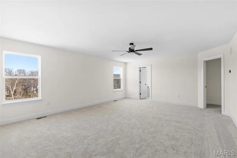 Carpeted empty room with ceiling fan — 3 Sequoia at Bluestem Estates, St Charles, MO 63367