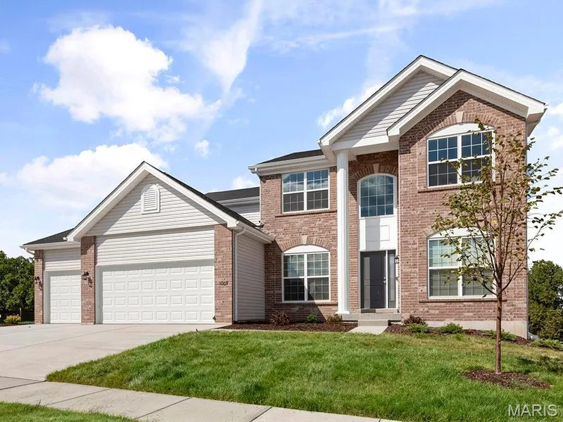 Front of property with a front yard and a garage — 3 Sequoia at Bluestem Estates, St Charles, MO 63367