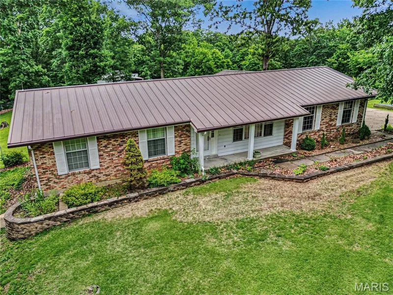 Make this home and 20 acres located in prime Missouri Wine Country your private estate! — 5520 Highway T, Augusta, MO 63332
