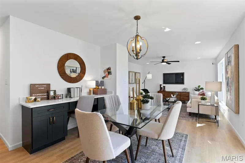 Dining room featuring light wood-style flooring, recessed lighting, a ceiling fan, and a chandelier — 3 Sterling at Elm Crossing, St Charles, MO 63301
