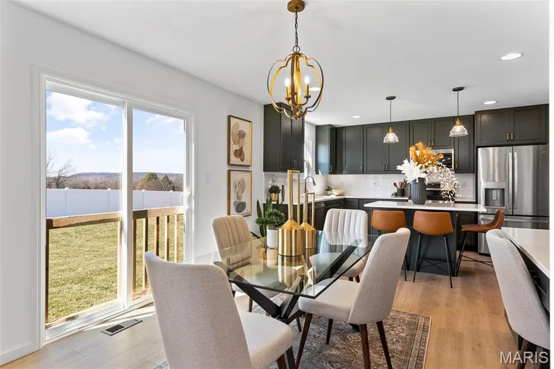 Dining area with light wood-type flooring, a chandelier, and recessed lighting — 3 Sterling at Elm Crossing, St Charles, MO 63301