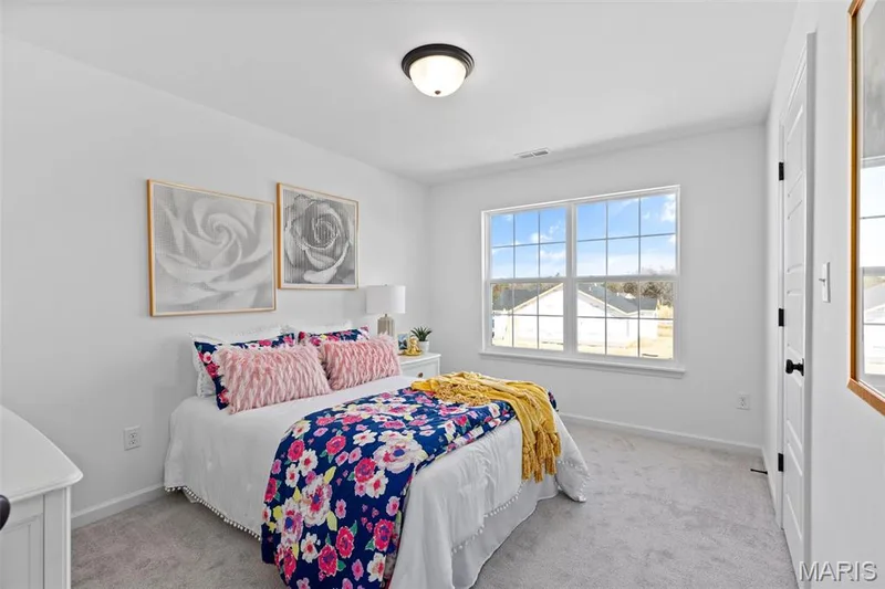 Bedroom featuring light carpet — 3 Sterling at Elm Crossing, St Charles, MO 63301