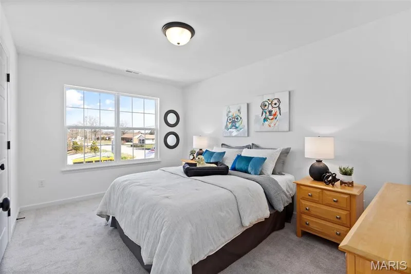 Bedroom with light colored carpet — 3 Sterling at Elm Crossing, St Charles, MO 63301