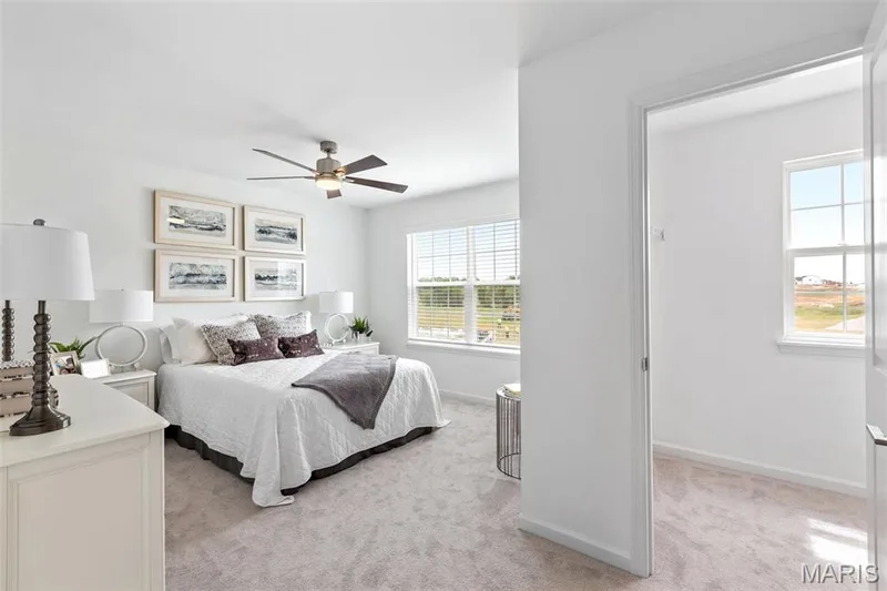 Carpeted bedroom with ceiling fan — 3 Ashford at Elm Crossing, St Charles, MO 63301