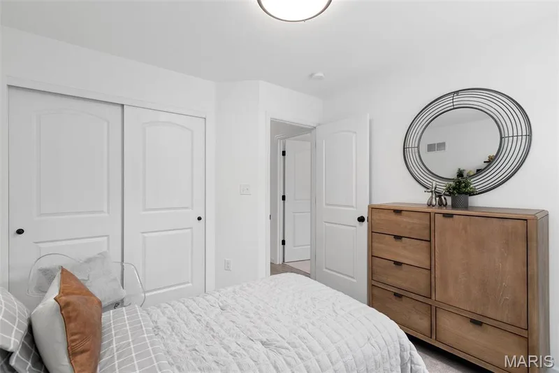 Carpeted bedroom featuring a closet — 3 Aspen at Elm Crossing, St Charles, MO 63301