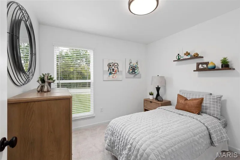 Bedroom featuring light colored carpet — 3 Aspen at Elm Crossing, St Charles, MO 63301