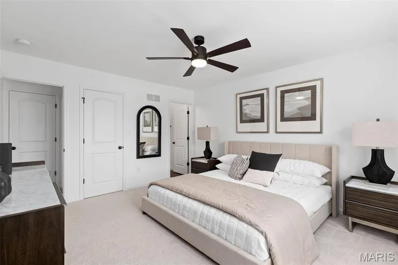 Bedroom featuring ceiling fan and light colored carpet — 3 Aspen at Elm Crossing, St Charles, MO 63301