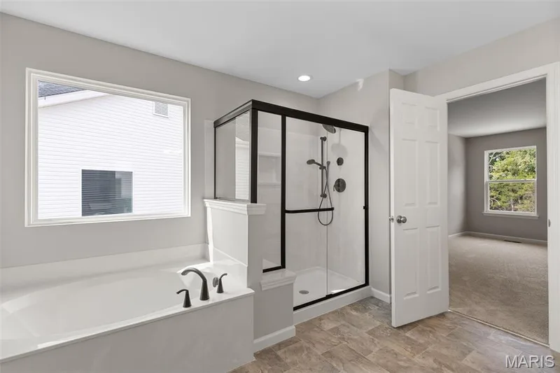 Bathroom with a garden tub and a shower stall — 225 Windmill View Drive, O'Fallon, MO 63385